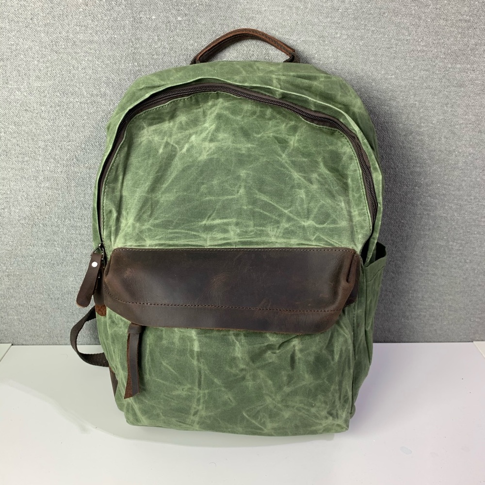 Hunter green waxed canvas and leather backpack